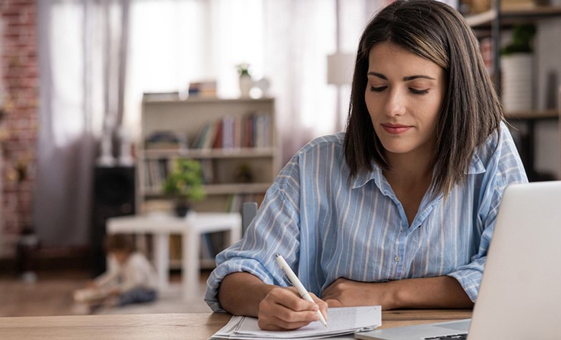 A woman is filling in a form for home education