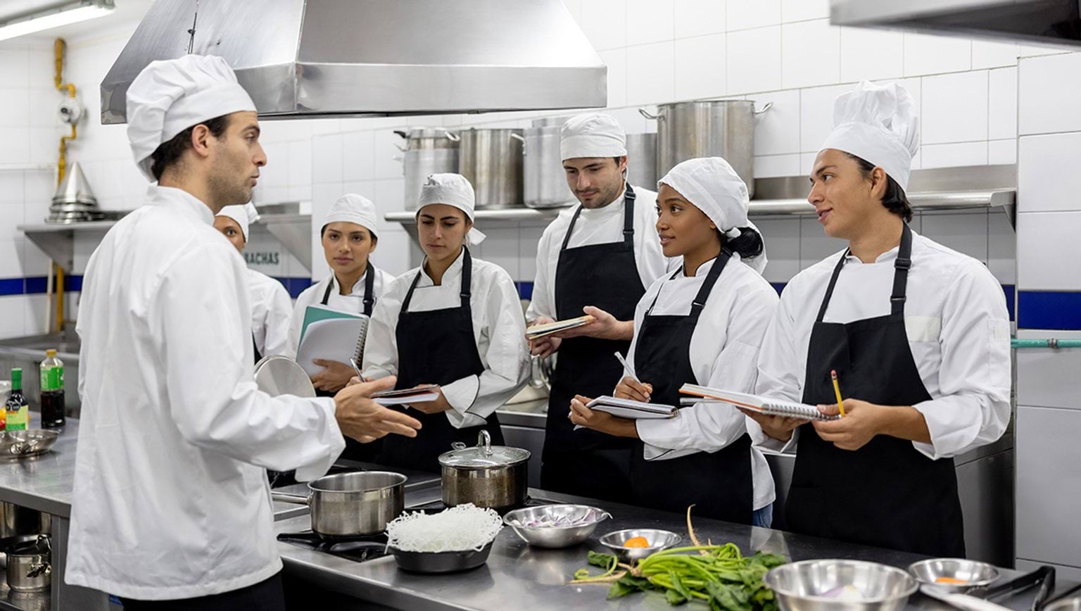 Chef teaching a class in a cooking school 